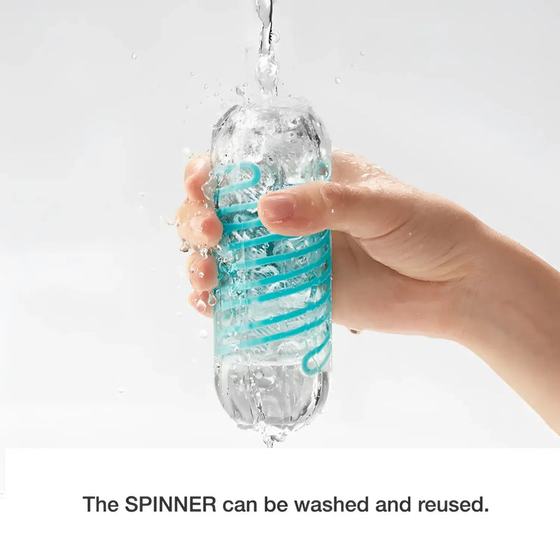 Hand rinsing TENGA SPINNER 06 BRICK sex toy under running water, perfect for drying stand use
