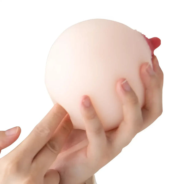 Hand holding a breast-shaped stress ball from Junyuu Meiki Ishihara Nozomi collection