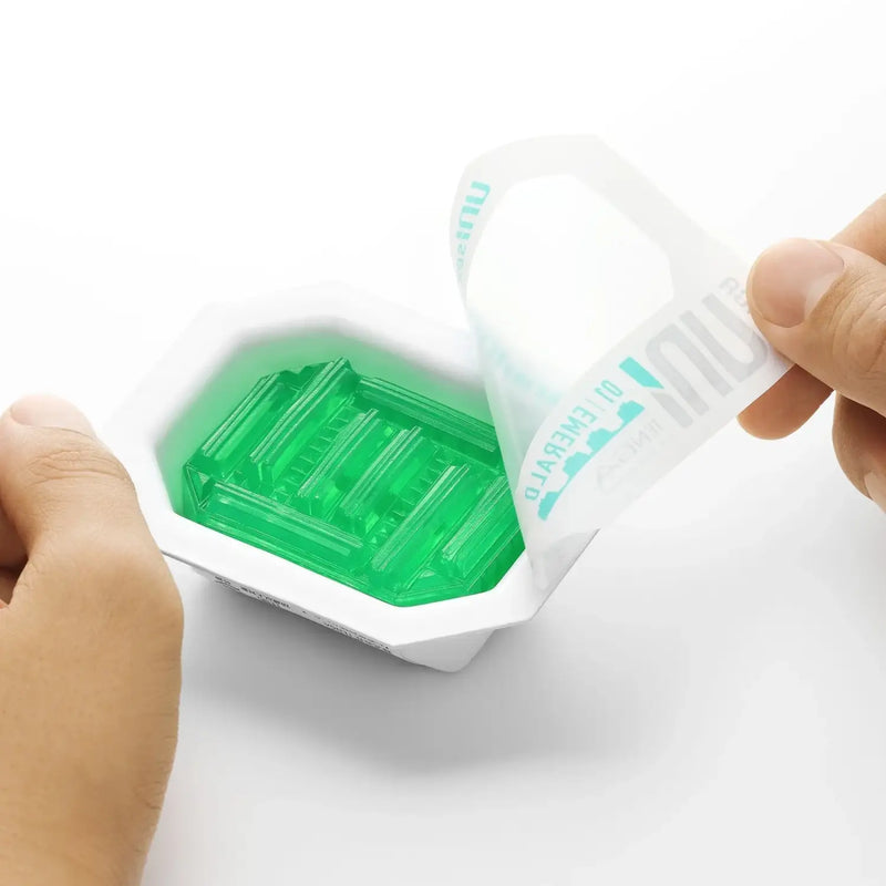Open TENGA UNI VARIETY PACK with translucent green gelatin candy, fun sex toy treat
