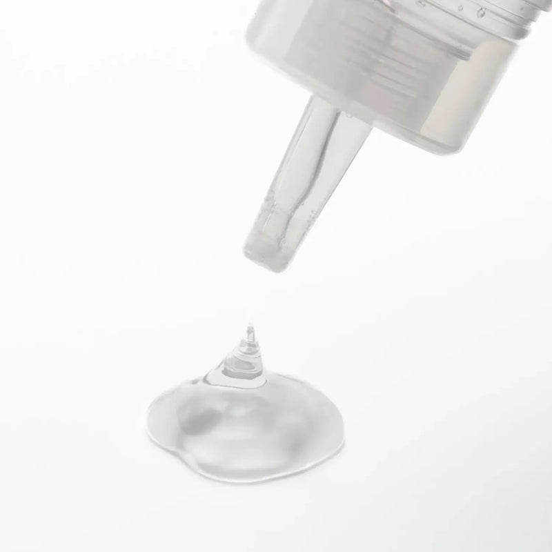 Clear liquid dispensing from TENGA LOTION LIGHT pump nozzle, perfect for sex toy use