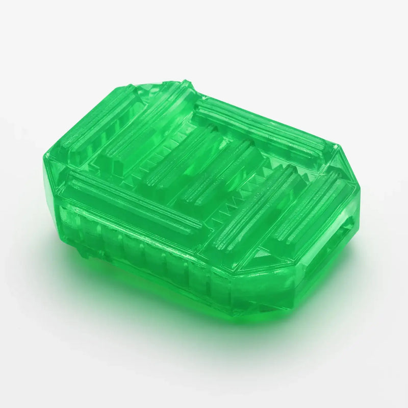Translucent green TENGA UNI EMERALD sex toy with ribbed lid and sleek design
