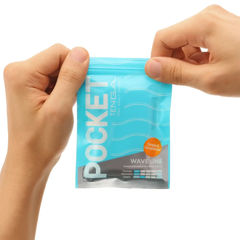 Hands holding POCKET TENGA CRYSTAL MIST sex toy pouch with wave pattern and info circle