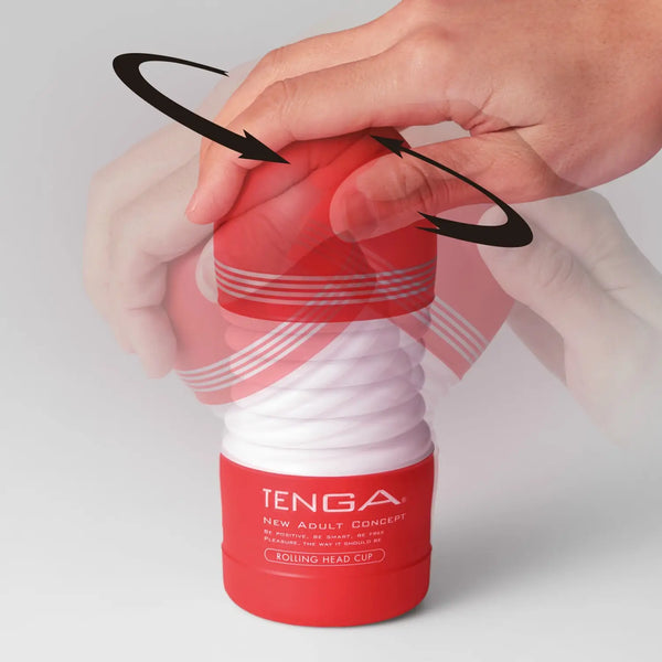 Red and white TENGA ROLLING HEAD CUP being used with a hand on the rolling head