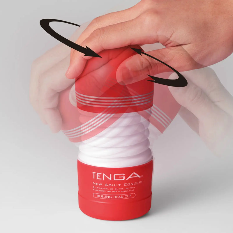 Red and white TENGA ROLLING HEAD CUP being used with a hand on the rolling head