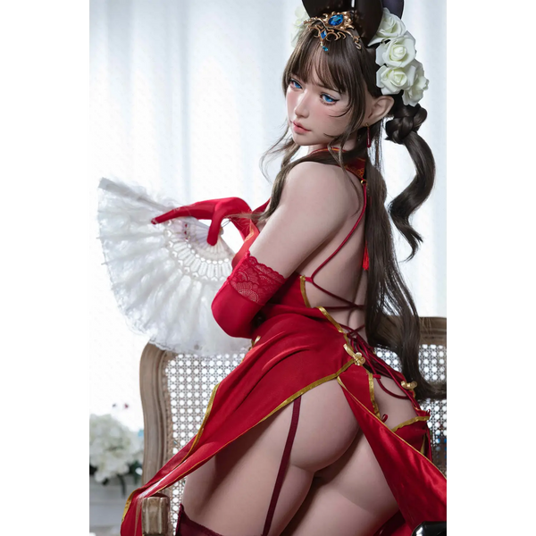 Aitia silicone sex doll in red lace-trimmed dress with gold accents