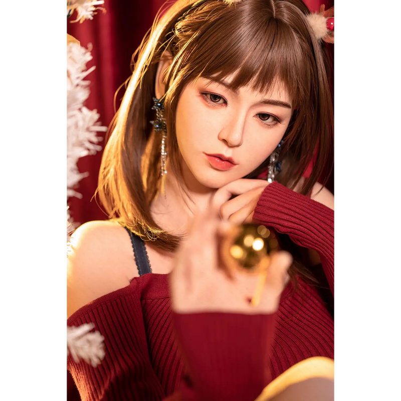 Gold Aitia silicone sex doll with red ribbon ornament