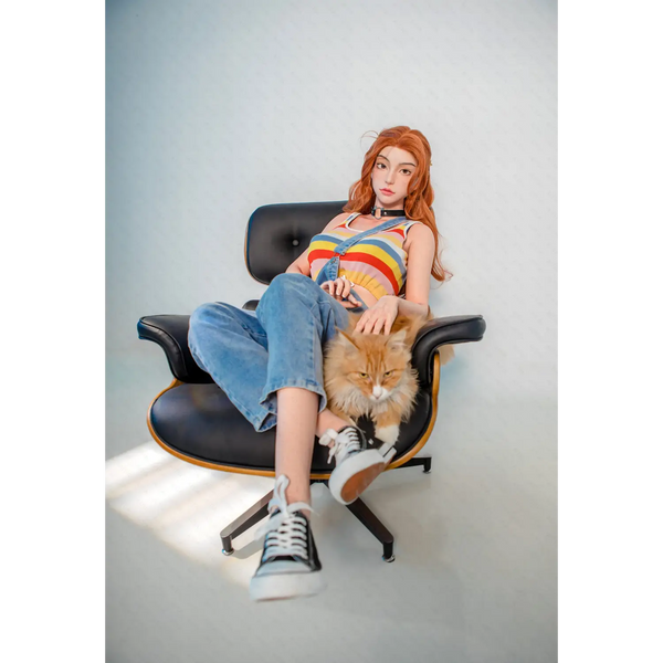 Black leather Eames lounge chair with Aglaia silicone sex doll