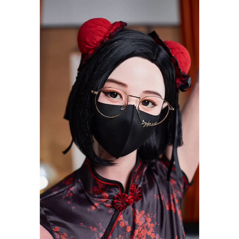Naimi silicone sex doll with black floral mask and clear glasses
