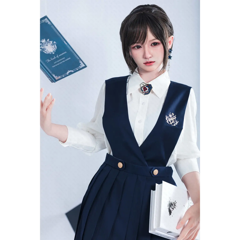 Navy blue pleated skirt, white shirt, brooch and silver buttons on Aitia girl silicone sex doll