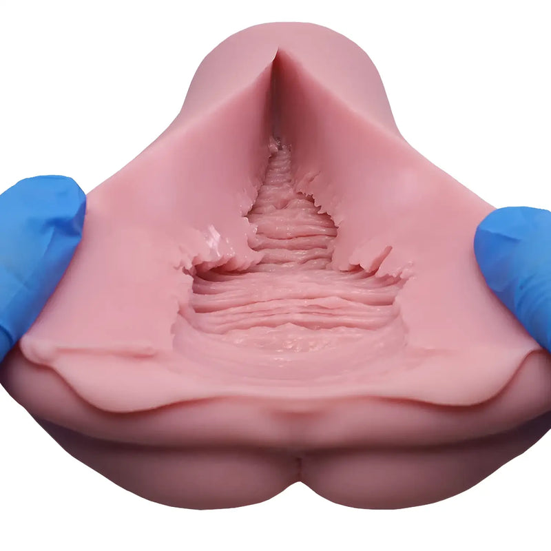 Pink TOMAX Virgo Phantasma cervix fantasy silicone mold with blue gloves