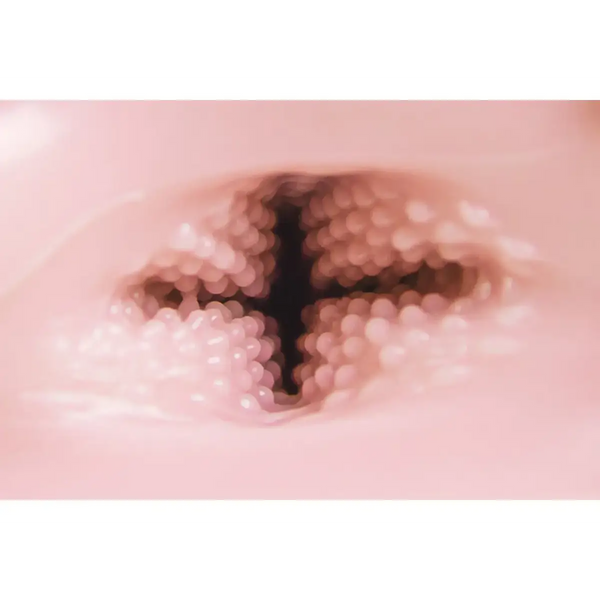 Pink speckled TOMAX Venus Cross onahole in soft ceramic vase